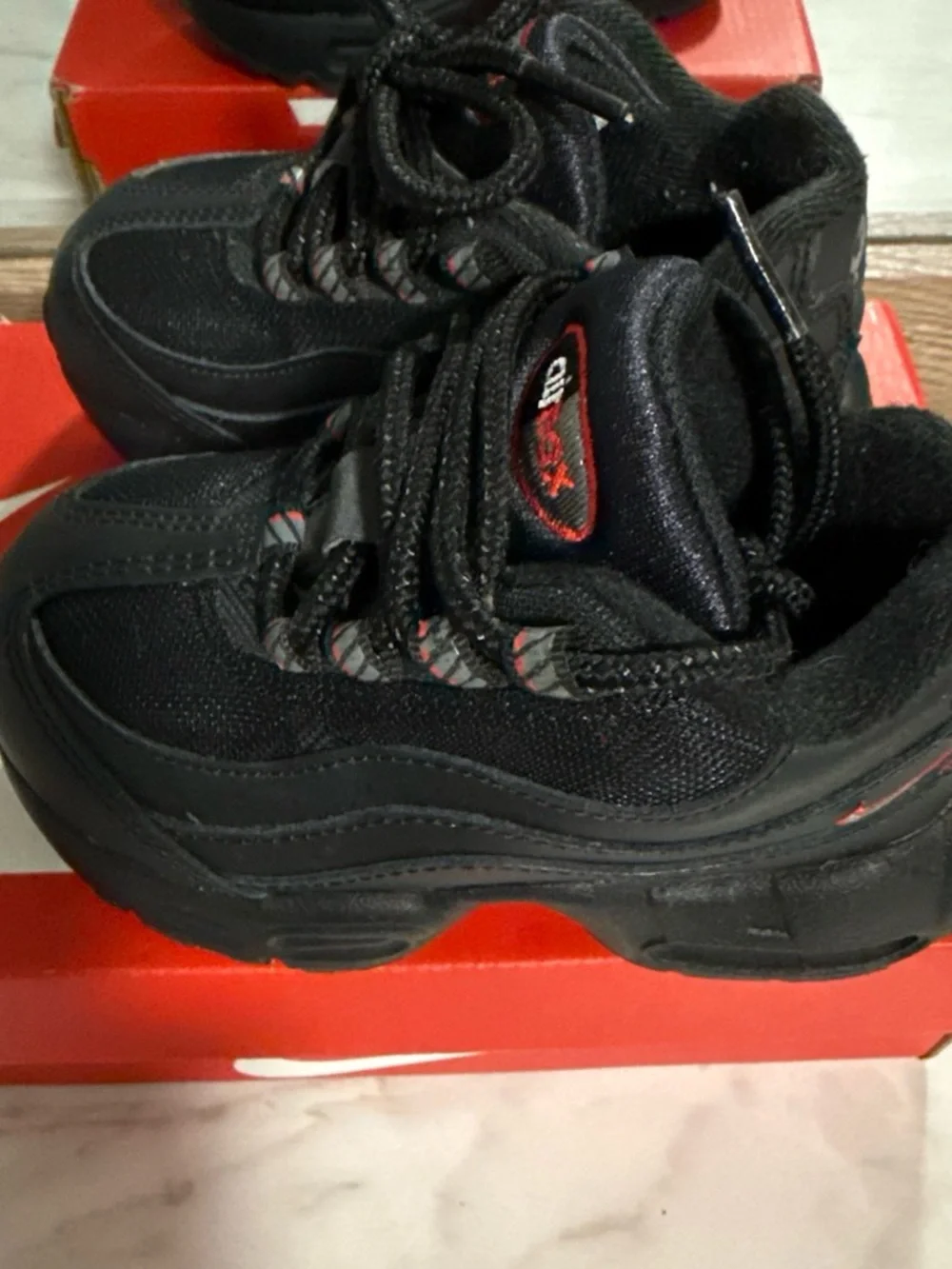 Nike Kids Black Sneakers with Red Accents